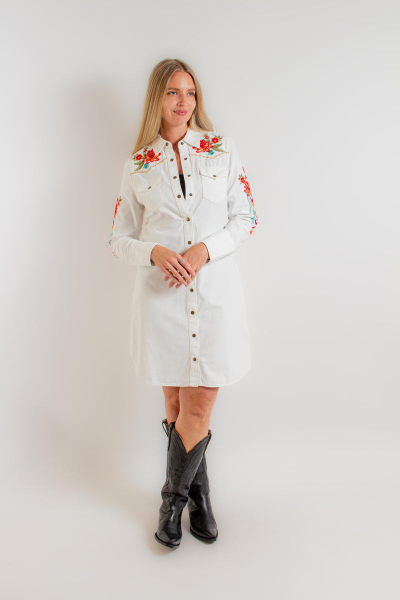 denim dress with white embroidery The embroidered denim midi timeless, feminine, and quietly statement-making. Designed with soft puff sleeves and intricate white detailing, it blends everyday ease with elevated charm. Perfect for modern summer dressing